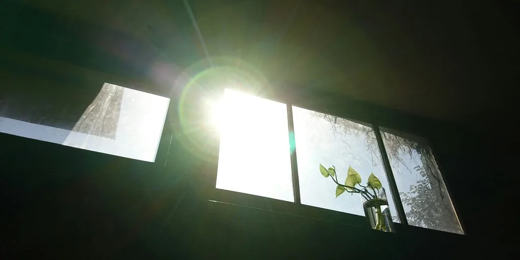 the sun is shining through the windows of a house